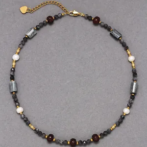 Detailed top view of a handmade mixed natural stone beaded necklace with gold accents