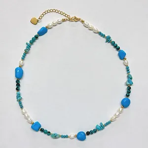 Vintage bohemian necklace featuring natural turquoise stones and white baroque pearls