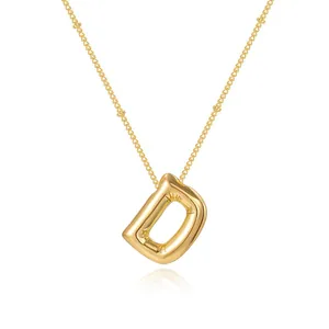 Gold-plated bubble letter D pendant necklace with delicate Saturn chain