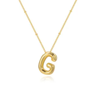 Shiny gold plated bubble letter G pendant necklace featuring a trendy balloon design