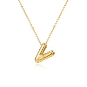 Elegant gold-plated bubble letter V pendant necklace with delicate satellite chain