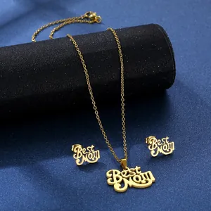 Detailed view of golden Best Mom necklace and stud earrings jewelry set on blue display