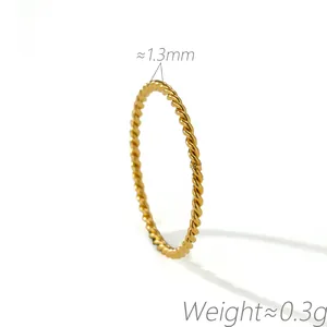 Detailed macro view showing the 1.3mm width and twisted texture of a gold rope ring
