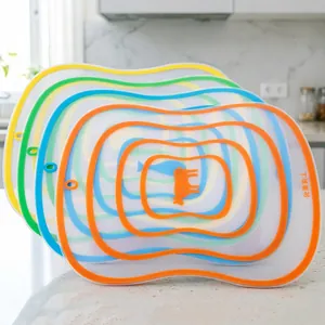 Set of 4 flexible frosted kitchen cutting boards with color-coded edges for food prep