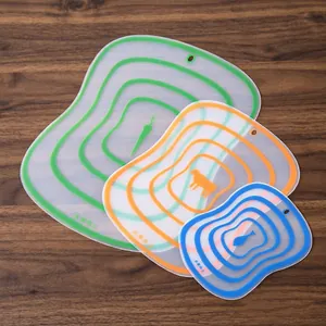 Set of three flexible frosted cutting boards with carrot, cow, and fish food category icons.