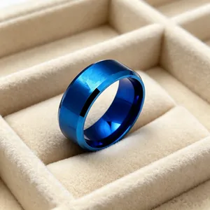 Close-up of blue brushed stainless steel ring with polished edges in a jewelry box
