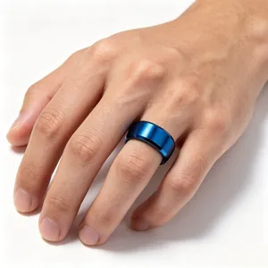 Detailed close-up of a 8mm blue brushed stainless steel minimalist ring worn on a finger