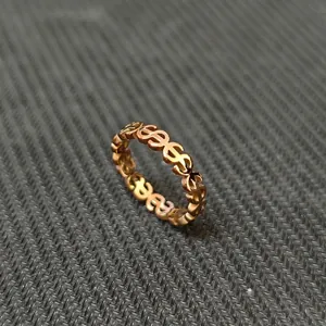 Detailed close-up view of a luxury 18k gold plated stainless steel hollow dollar sign ring