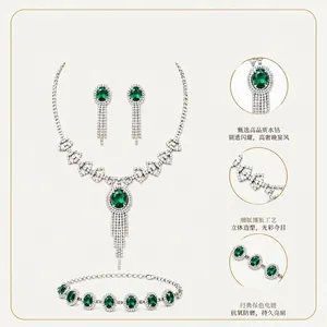 Detail view of green crystal bridal jewelry set with necklace, earrings, and bracelet.