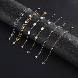 Varios estilos de pulseras de acero inoxidable con perlas y cuentas de piedra