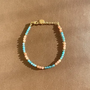 Bohemian beaded bracelet with blue and peach natural stones in a high-detail close-up
