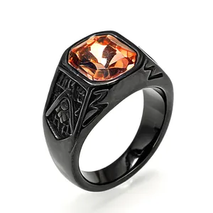 Detailed view of a black titanium Masonic ring set with a large orange square crystal
