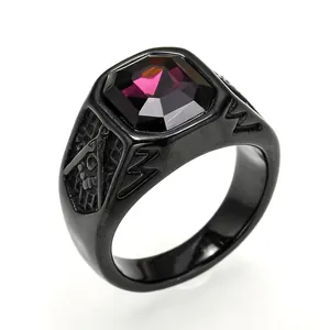 Close-up of black titanium ring featuring a large purple gemstone and Masonic engraving
