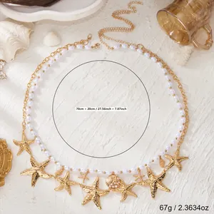 Detail der böhmischen goldenen Taillenkette mit Seesternen, Muscheln und Kunstperlen.