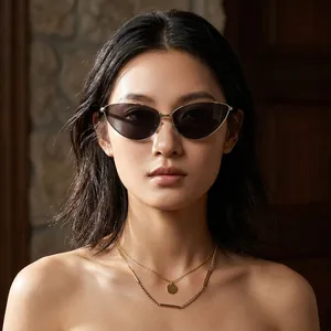 Trendy metal cat-eye sunglasses for women with dark lenses on an Asian fashion model