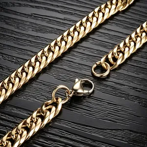Macro detail of high polished gold stainless steel cuban link chain and lobster clasp