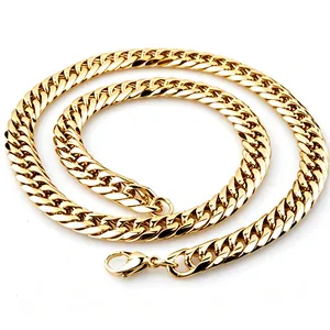 Close-up of golden stainless steel curb chain with six-sided faceted links and lobster clasp.
