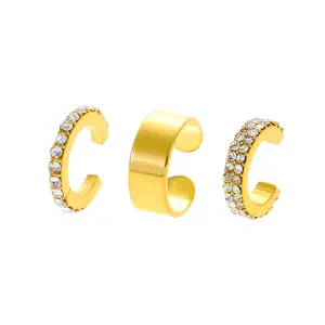 Detailed view of three gold-plated ear cuffs set featuring micro-paved zircons and a smooth band
