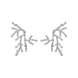 Detailed view of silver branch coral inspired fashion earrings on white background