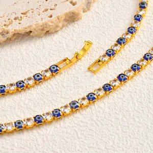 Close-up detail of gold-plated copper bracelet with Evil Eye charms and zircons