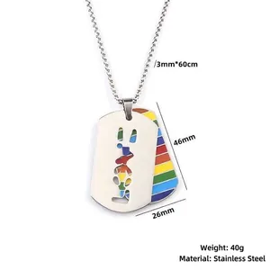 Detail view of a stainless steel rainbow dog tag necklace with LGBTQ letter cutout.