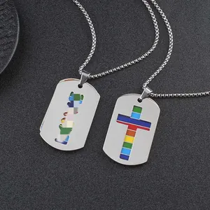 Detail of stainless steel dog tag necklaces with rainbow cross and LOVE cutout pendants.