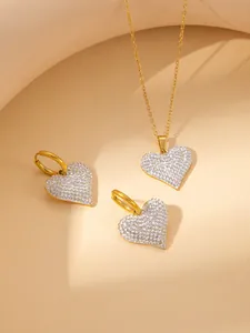 Sparkling heart-shaped necklace and earring jewelry set with pavé stones in gold finish