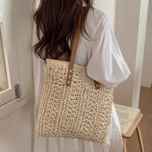 Elegant hand-woven straw tote bag for women, perfect for beach vacations or daily use