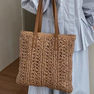 Large capacity hand-woven straw tote bag with brown straps perfect for beach vacation