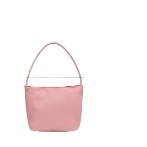 Stylish minimalist pink nylon bucket handbag featuring a sleek single handle design
