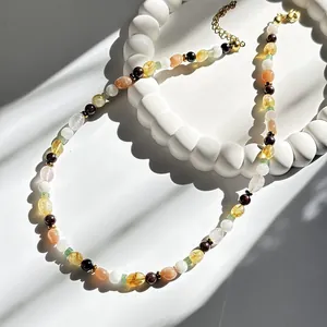 Detail view of a vintage colorful natural stone necklace with irregular bead shapes