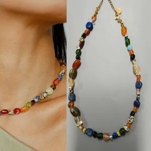 Detailed view of irregular colorful natural stone necklace with vintage oil painting texture