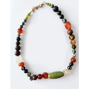 Detailed view of irregular colorful natural stone beads on a retro style necklace