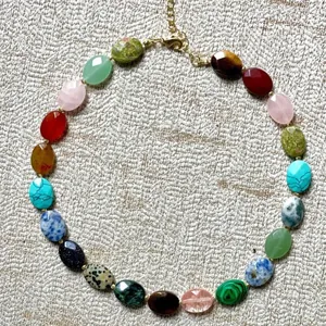 Detailed view of vintage colorful natural stone necklace featuring diverse oval beads