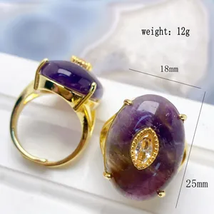 Detailed view of French style gold adjustable ring with purple gemstone and crystal