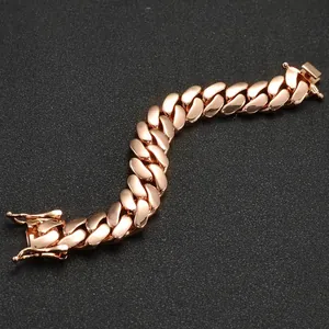 Detail view of a high-polished rose gold Cuban link bracelet with a secure box clasp