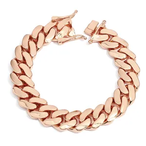Close-up macro view of a polished rose gold chunky Cuban link chain bracelet for men