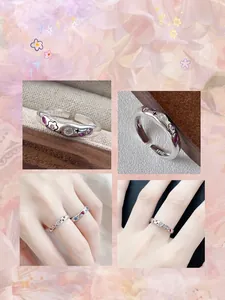 Detailed view of the S925 sterling silver ring with pink zircon stones and stars