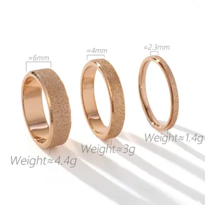 Detail of three rose gold frosted rings in 6mm, 4mm, and 2.3mm widths with weight info
