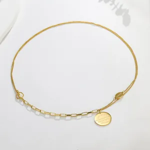 Detailed view of a gold double-layer OT buckle necklace with engraved circular pendant