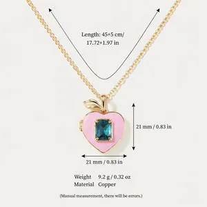 Elegante collar de relicario en forma de corazón rosa melocotón con gema azulada
