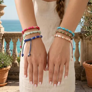 Close-up showing bohemian handmade semi-precious stone woven bracelets with colorful beads