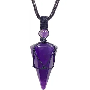 Close-up of a purple amethyst hexagonal crystal pendulum pendant with black rope net wrap.