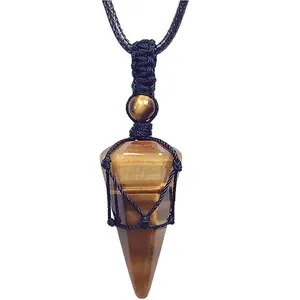 Detail of a tiger eye stone pendulum pendant with a hand-woven black cord necklace.
