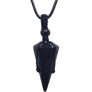 Close-up detail of natural black obsidian dowsing pendulum pendant with black braided rope