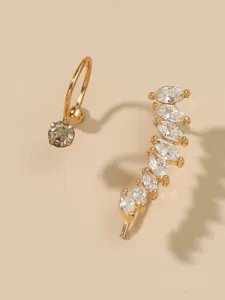 Detailed macro view of a gold-toned ear cuff set with marquise-cut sparkling clear zircons
