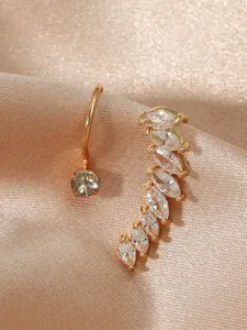 Macro view of a gold-plated ear cuff and stud set with marquise-cut zircon stones