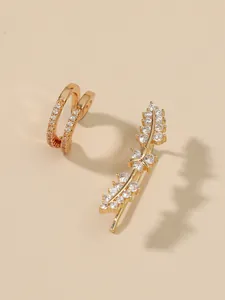Detailed macro view of elegant gold leaf-shaped ear climber and pavé zircon ear cuff