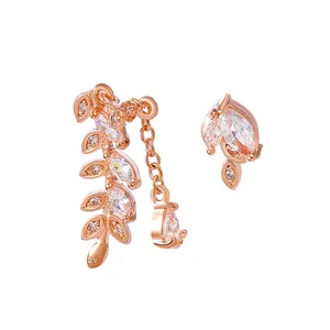 Close-up of rose gold leaf ear cuff and earring set with sparkling cubic zirconia