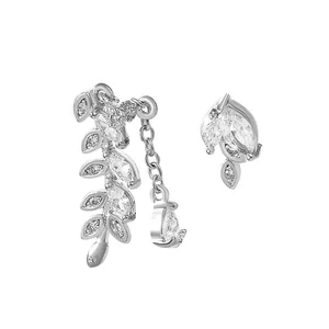 Close-up detail of silver leaf ear cuff and stud set with shimmering cubic zirconia